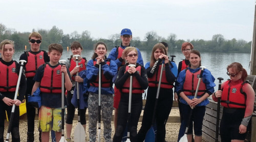 Group of young people boating